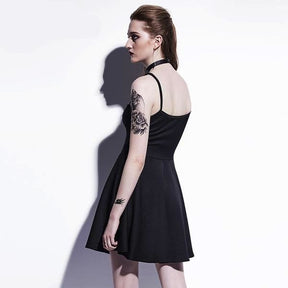 Rear three-quarter view of the black dress, showing narrow shoulder straps, a curved back neckline and a plain fitted bodice above the flared skirt.