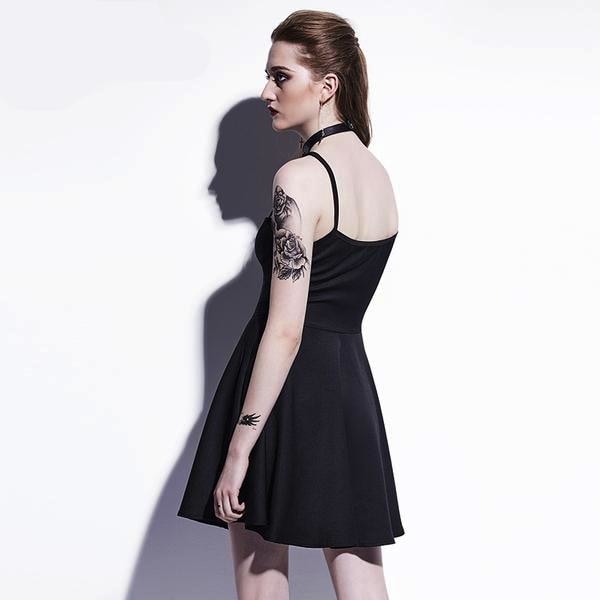 Rear three-quarter view of the black dress, showing narrow shoulder straps, a curved back neckline and a plain fitted bodice above the flared skirt.