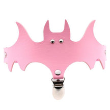 Pink bat-shaped garter with a matching narrow band and silver-tone stocking clip.