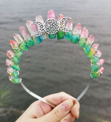 Front view of a pink green crystal point crown with a silver-tone triple moon emblem and wire-wrapped band.