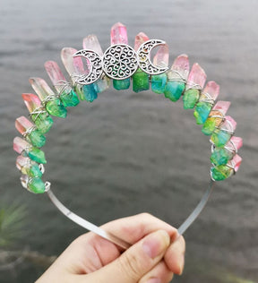 Front view of a pink green crystal point crown with a silver-tone triple moon emblem and wire-wrapped band.