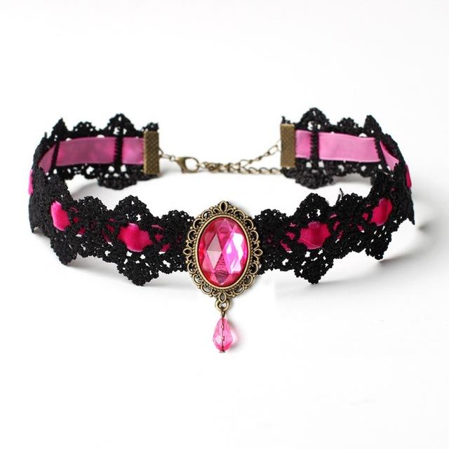 Black lace choker with an ornate oval centerpiece and hanging teardrop in the Pink ribbon and jewel option.
