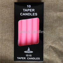 Pink slender ritual candles displayed with their box, showing the candle colour and straight sides.