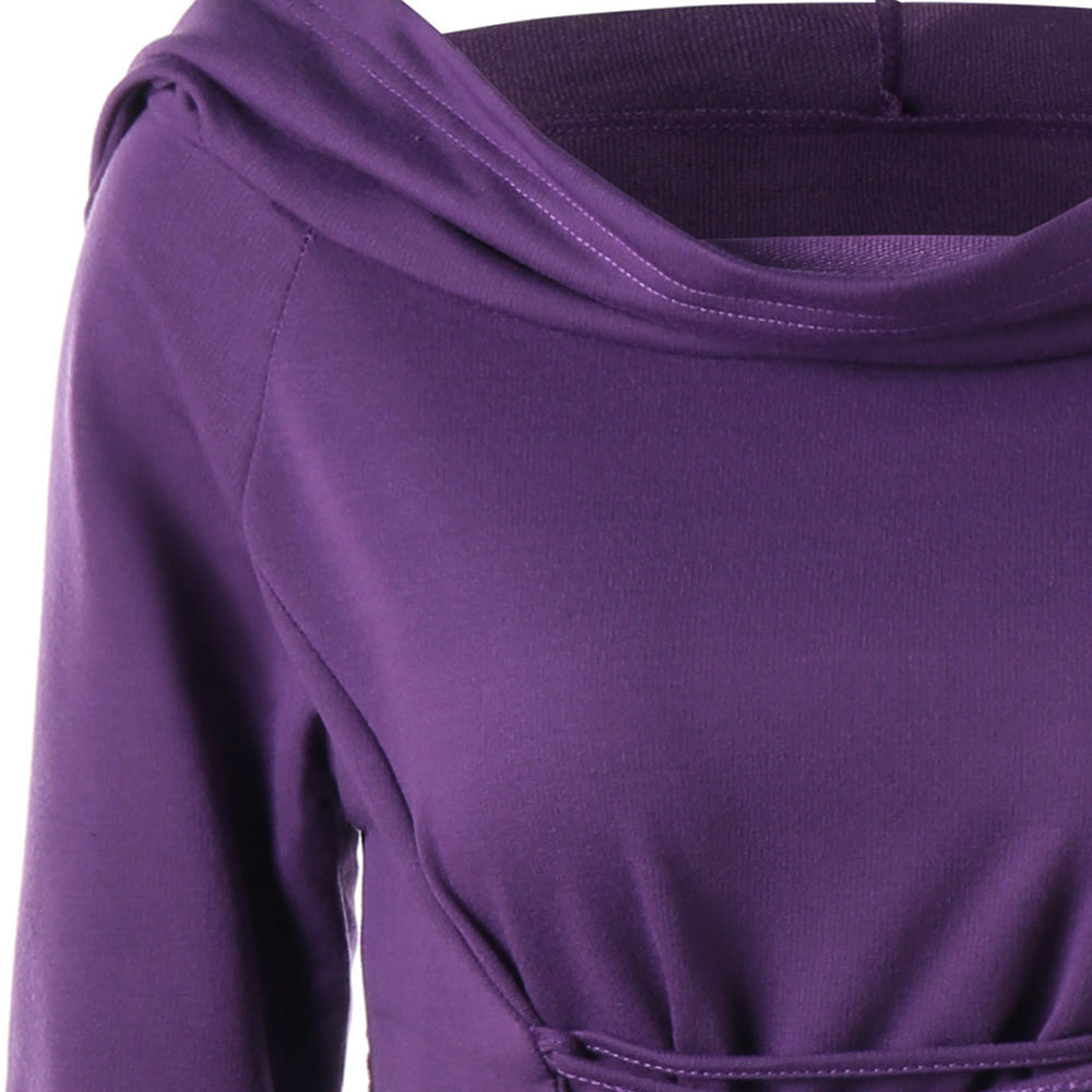 Close-up of the purple dress neckline, showing the draped cowl and shoulder seam.