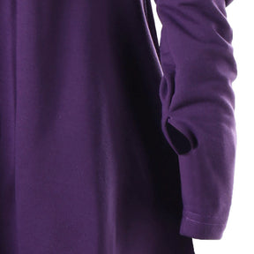 Close-up of the purple dress sleeve, showing the thumb opening near the cuff.