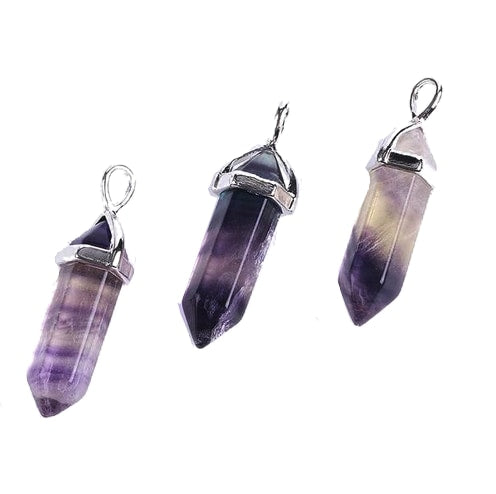 Three purple fluorite pendants side by side, showing differences in banding and translucency.