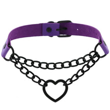 Purple faux leather heart choker with black oval-link chains and an adjustable buckle, arranged in a circle on white.
