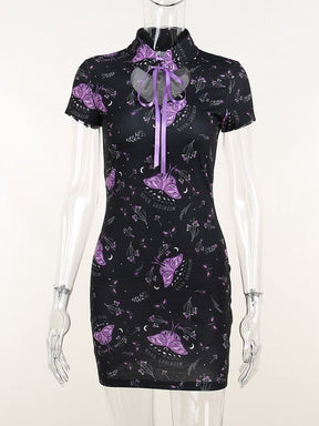 Purple moth mini dress on a clear mannequin, with a tied mandarin collar, short sleeves and a fitted black body.
