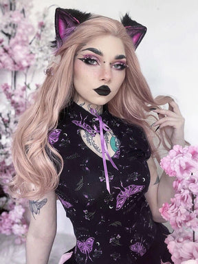 Black and purple moth dress styled with cat-ear accessories beside pink flowers. The mandarin collar and purple ribbon frame the keyhole neckline.