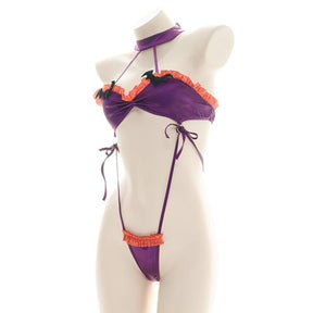 Purple and orange ruffled bat monokini with black bat embellishments, a matching neckband, and narrow side ties