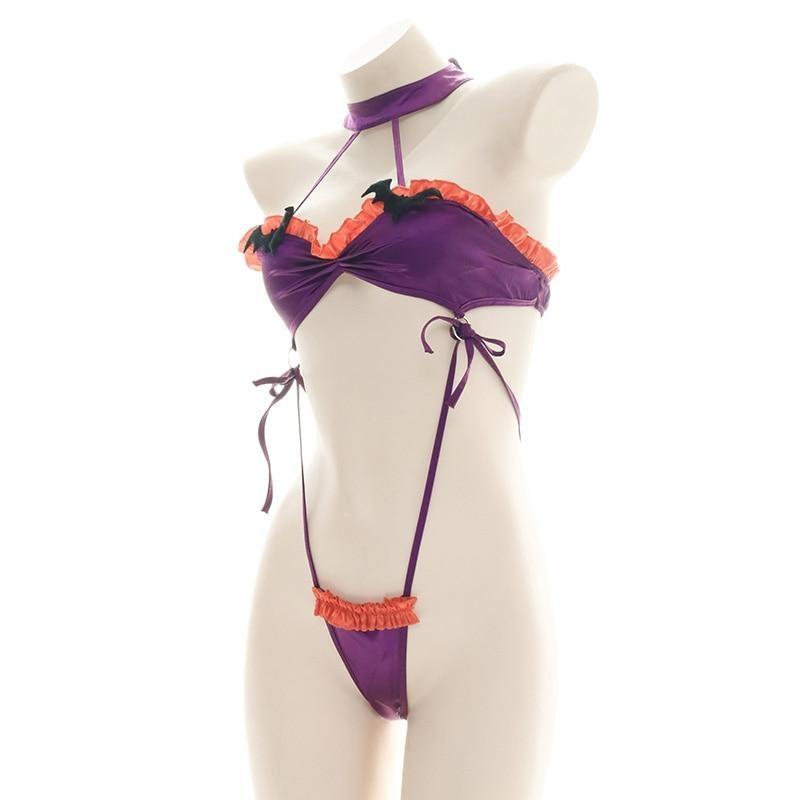 Purple and orange ruffled bat monokini with black bat embellishments, a matching neckband, and narrow side ties