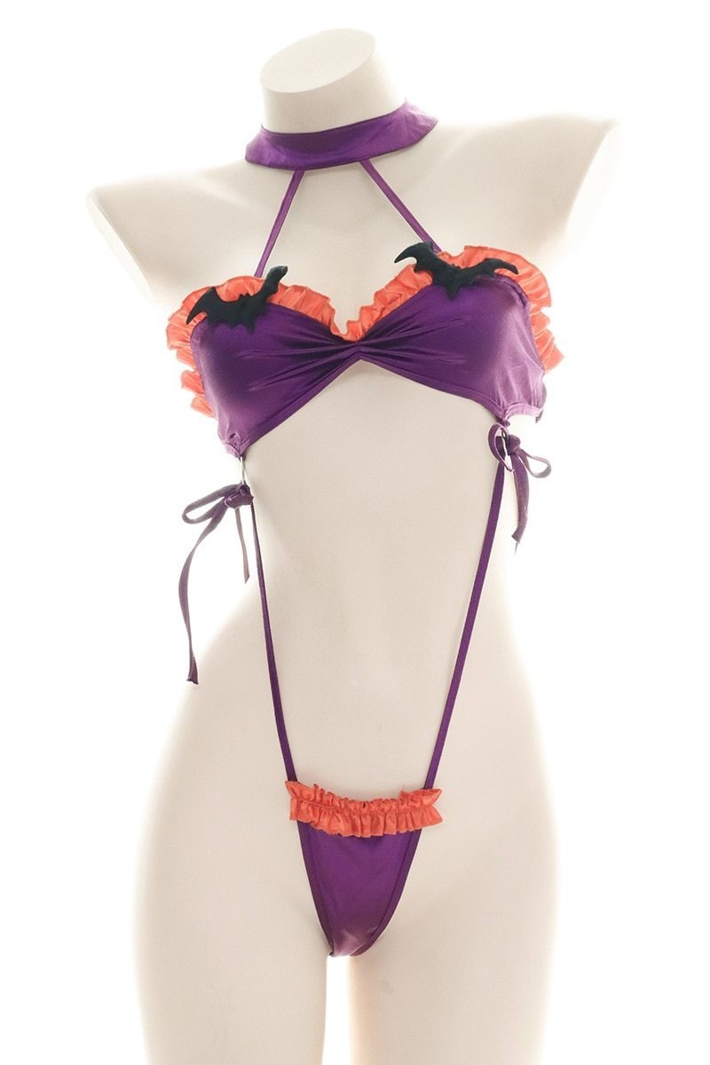 Purple and orange ruffled bat monokini with black bat embellishments, a matching neckband, and narrow side ties