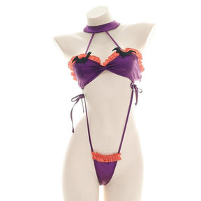Purple and orange ruffled bat monokini with black bat embellishments, a matching neckband, and narrow side ties