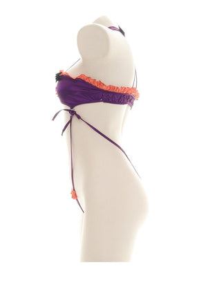 Purple and orange ruffled bat monokini with black bat embellishments, a matching neckband, and narrow side ties