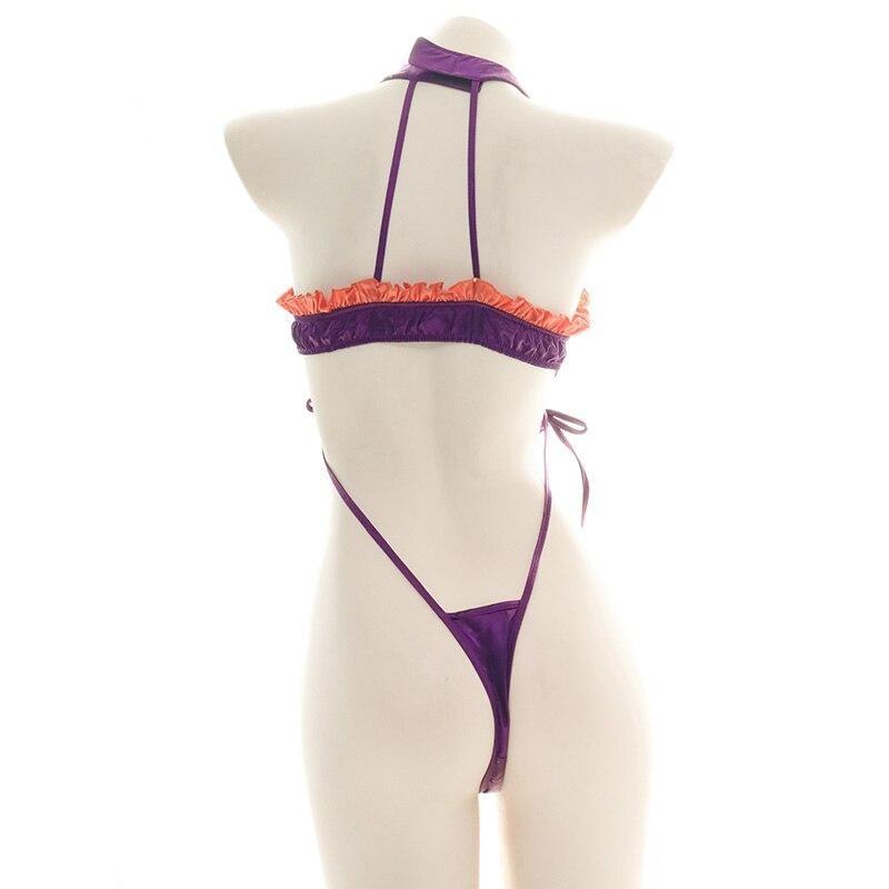 Purple and orange ruffled bat monokini with black bat embellishments, a matching neckband, and narrow side ties