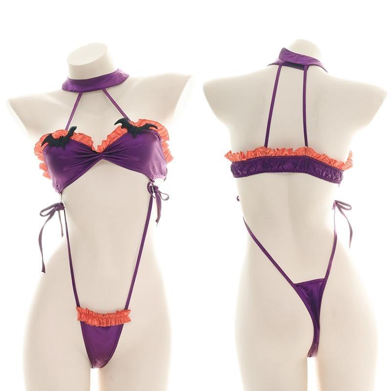 Purple and orange ruffled bat monokini with black bat embellishments, a matching neckband, and narrow side ties