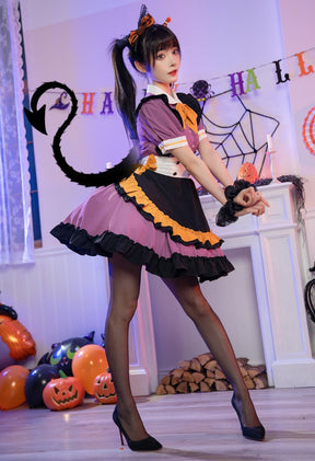 Rear angled outfit view of the purple ruffle dress with a white back bow, styled with black hosiery and a black cat-tail accessory.