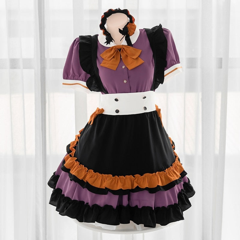 Pumpkin Queen Halloween dress on a mannequin, showing the white collar, orange bow, black shoulder ruffles and tiered purple-and-black skirt.