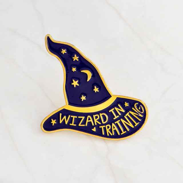 Purple Wizard in Training hat pin with a gold-tone crescent moon, stars and outlined brim.