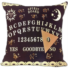 Deep purple square spirit-board pillow cover with pale alphabet rows, small zodiac symbols, sun and moon motifs, a printed planchette and a looping border.