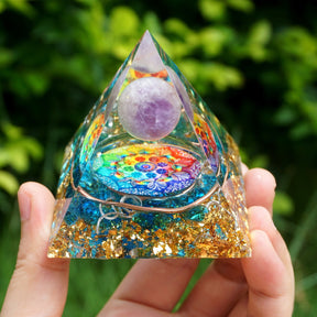 Additional view of Rainbow mandala orgone pyramid with a pale purple sphere, blue stone details and gold-tone flecks. A second full front view shows the pale sphere above the blue layered base.