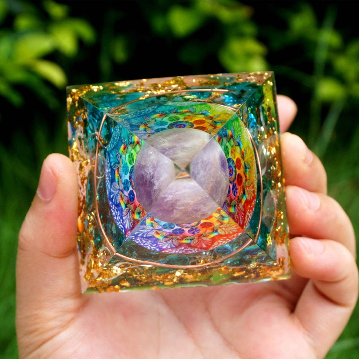 Additional view of Rainbow mandala orgone pyramid with a pale purple sphere, blue stone details and gold-tone flecks. The repeated top view highlights the clear edges around the circular design.