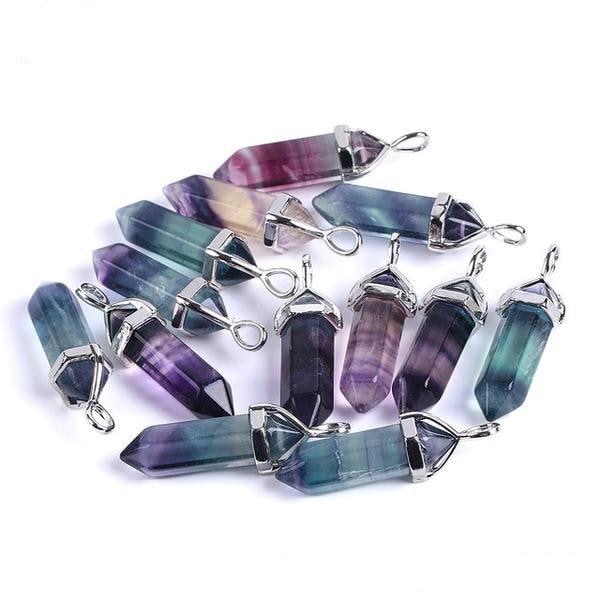 Rainbow fluorite pendants arranged together, with mixed translucent colour bands and pointed lower ends.
