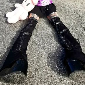 Black leg warmers seated side view