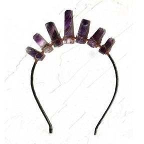 Amethyst crystal point tiara with an uneven row of purple points and copper wrapping on a dark open headband.