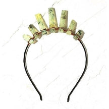 Smoky quartz tiara with pale earthy translucent points of varied heights along a dark headband.