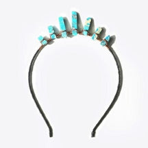 Turquoise-blue point tiara shown on its own, with pale and brown markings in the points and copper wire at their bases.