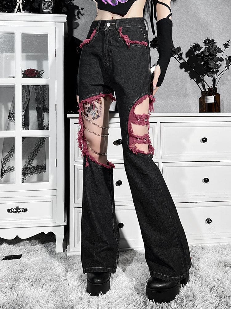 Full front view of the black Y2K flare jeans, from the high buttoned waist to the wide hems beneath red-framed cutouts.
