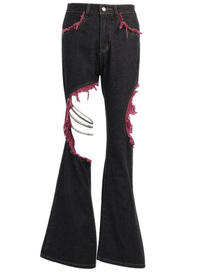 Red and black distressed flare jeans isolated against white, showing asymmetric leg openings, draped chains and wide hems.
