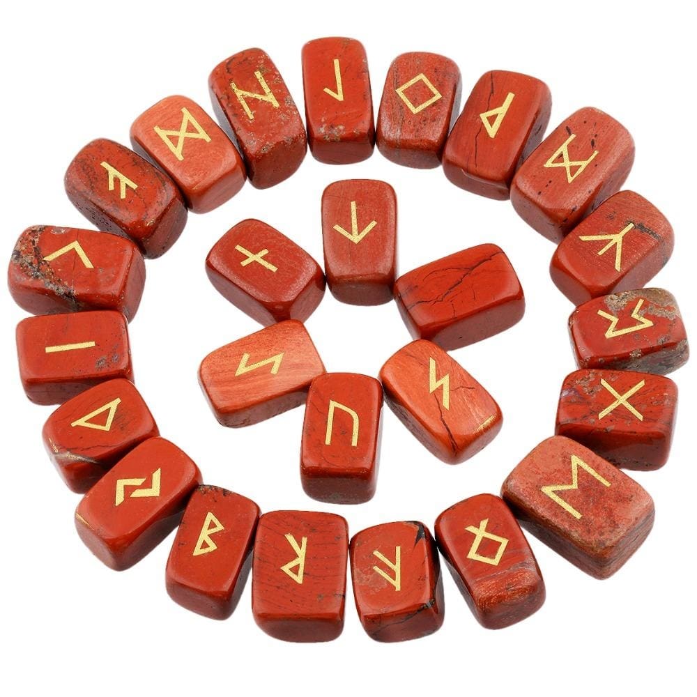 Red jasper rune stones arranged in a circle, with brick red with darker markings polished surfaces and gold-coloured characters. The set includes a blank stone.
