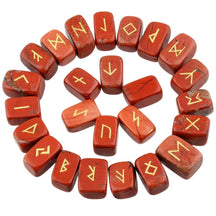 Red jasper rune stones arranged in a circle, with brick red with darker markings polished surfaces and gold-coloured characters. The set includes a blank stone.