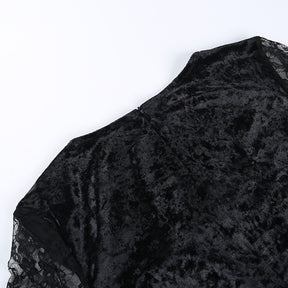 The black velvet back of the Red Moon dress laid flat, showing its textured sheen.