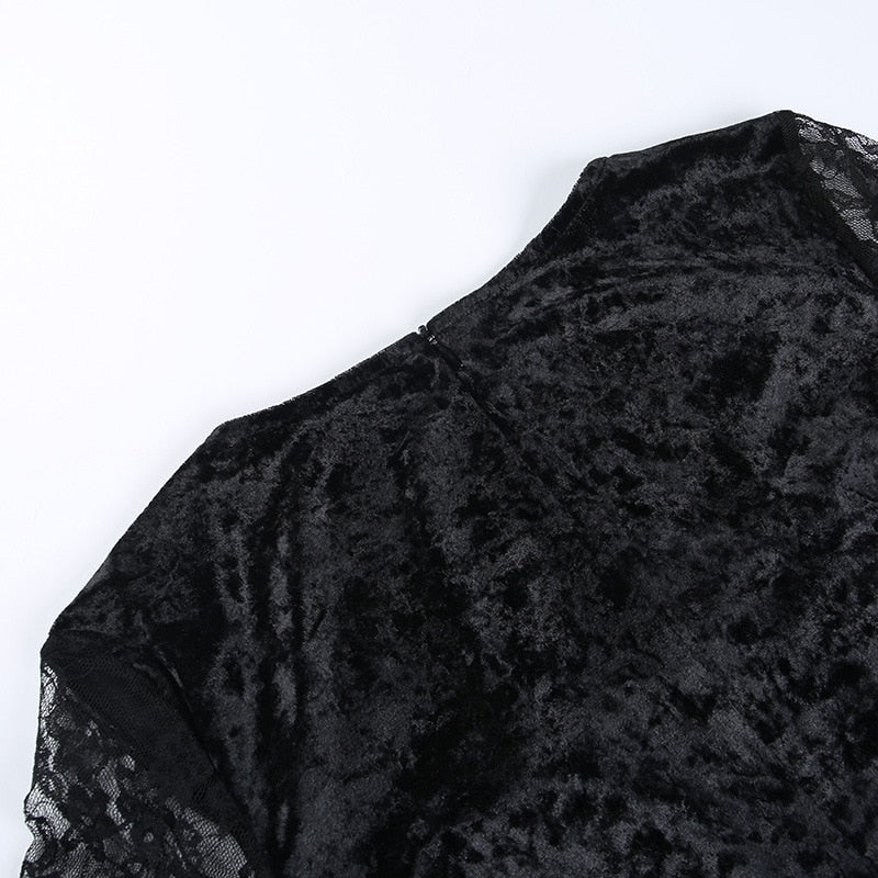 The black velvet back of the Red Moon dress laid flat, showing its textured sheen.