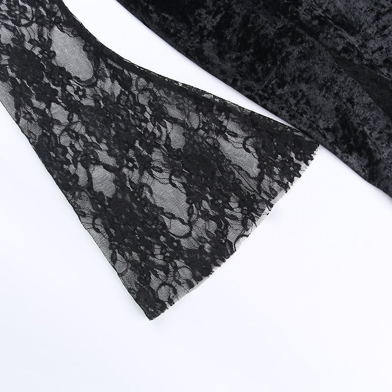 Black floral lace bell sleeve laid flat, showing its sheer pattern and flared cuff.