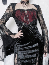 Red Moon gothic dress worn with one hand at the waist, showing a wine-red lace-covered bodice, silver-tone chains and black velvet skirt.