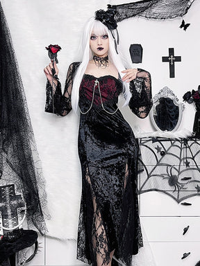 Black and wine-red gothic dress worn while holding a rose, showing long lace sleeves and sheer panels through the skirt.