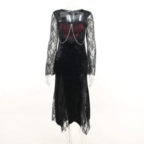 Front mannequin view of the black velvet dress with a wine-red lace-covered bodice, draped chains and bell sleeves.