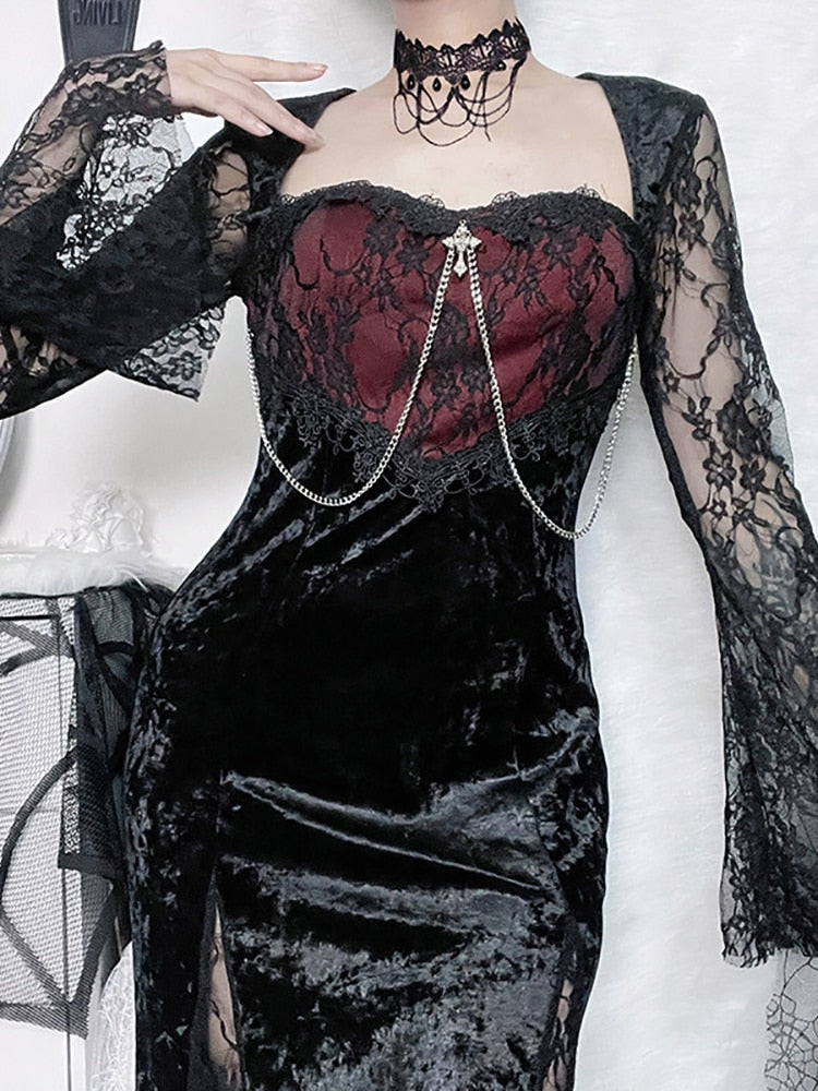 Close view of the Red Moon dress's curved red bodice, black floral lace and draped front chains.