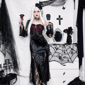 Red Moon dress worn with pale hair and a rose prop, framed by black floral decorations and a spiderweb mirror.