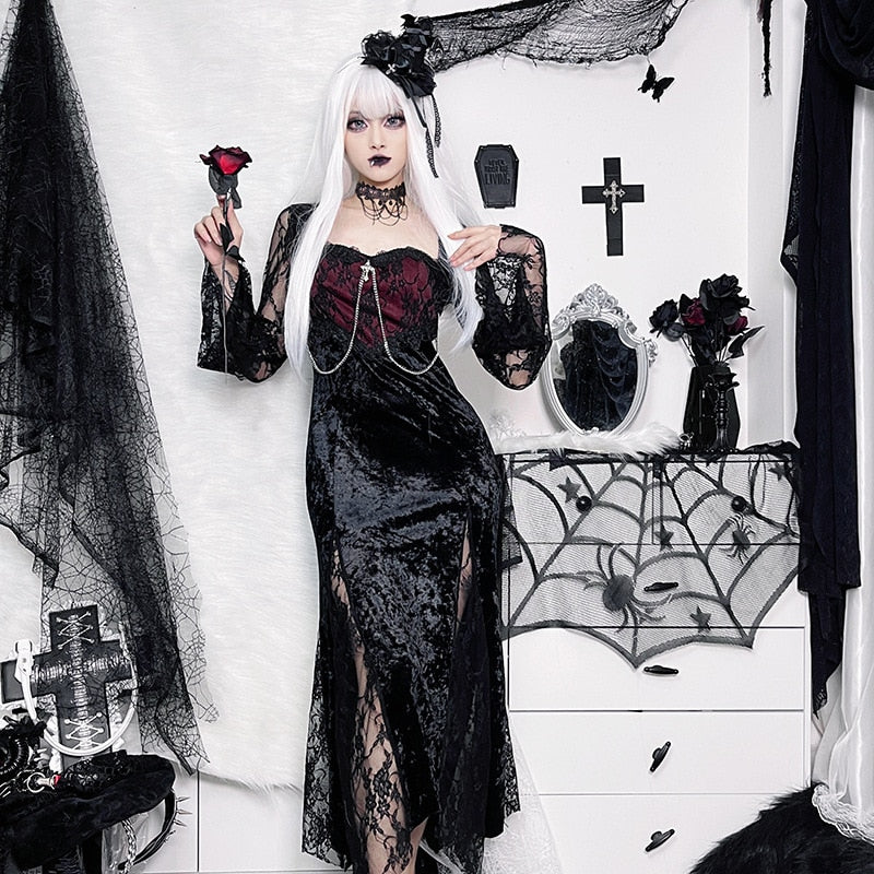 Red Moon dress worn with pale hair and a rose prop, framed by black floral decorations and a spiderweb mirror.