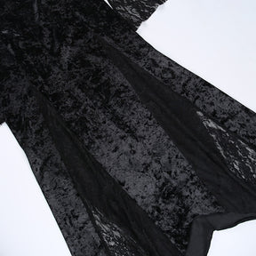Detail of the black velvet skirt with long sheer floral lace inserts between the opaque panels.