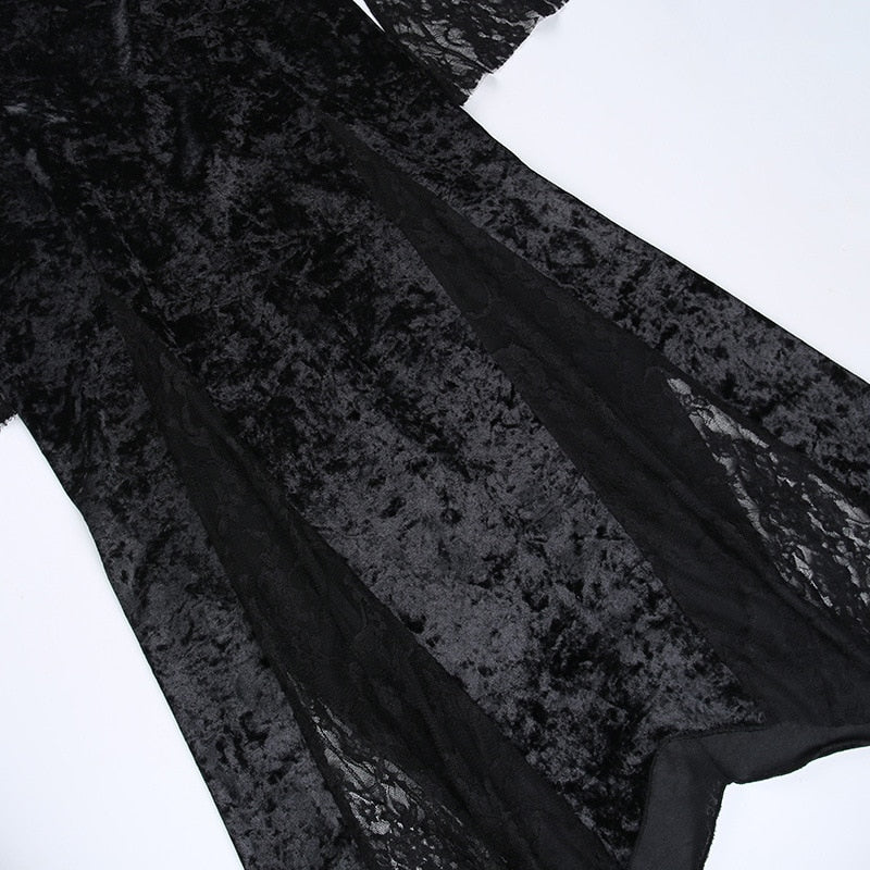 Detail of the black velvet skirt with long sheer floral lace inserts between the opaque panels.