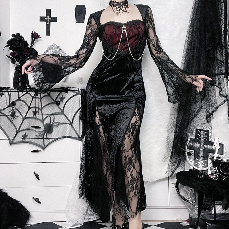 Red Moon dress worn with arms extended to show both floral lace bell sleeves and the fitted skirt.