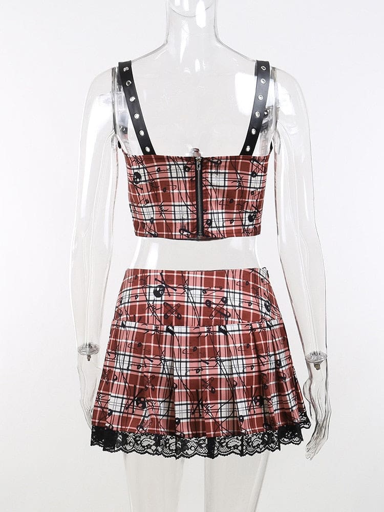 Back view of the red plaid top and skirt set on a clear mannequin, with a dark central zipper on the cropped top and black lace at the skirt hem.