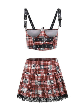 Red plaid underbust crop top and matching pleated skirt displayed separately on white. Black buckles decorate the top, and floral lace edges the skirt hem.