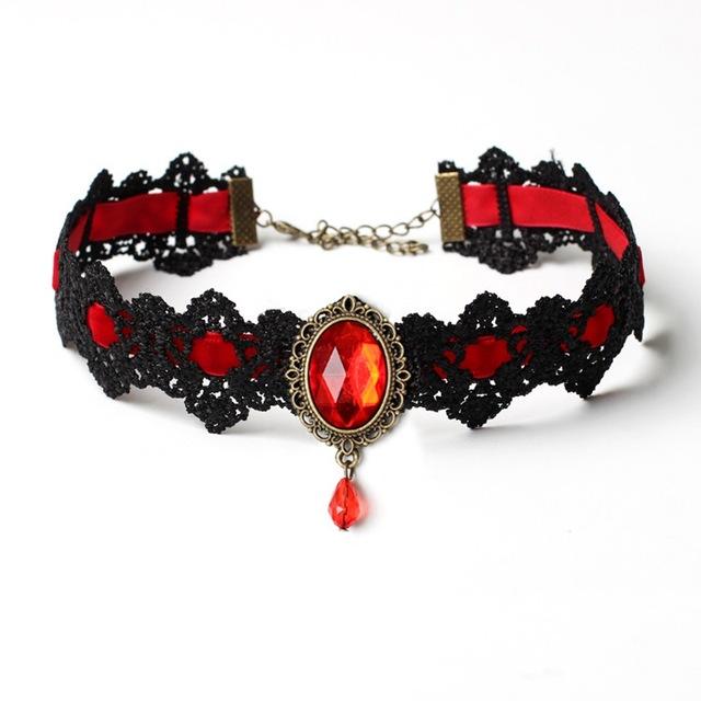 Black lace choker with an ornate oval centerpiece and hanging teardrop in the Red ribbon and jewel option.